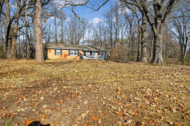 a view of a backyard of the house