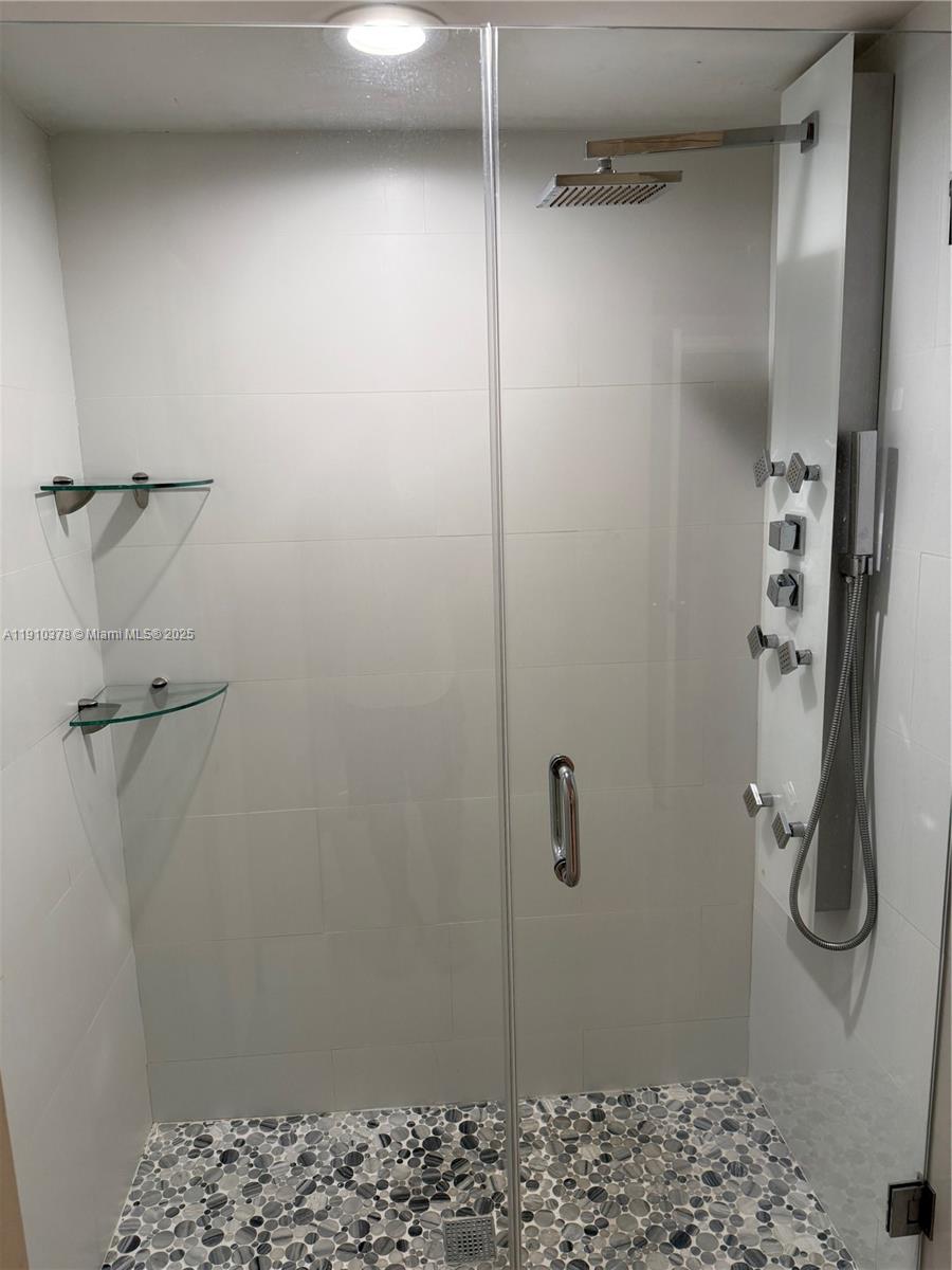 17150 North Bay Road, Unit 2102 Sunny Isles Beach, FL 33160 - Photo 15 of 29 a bathroom with a shower