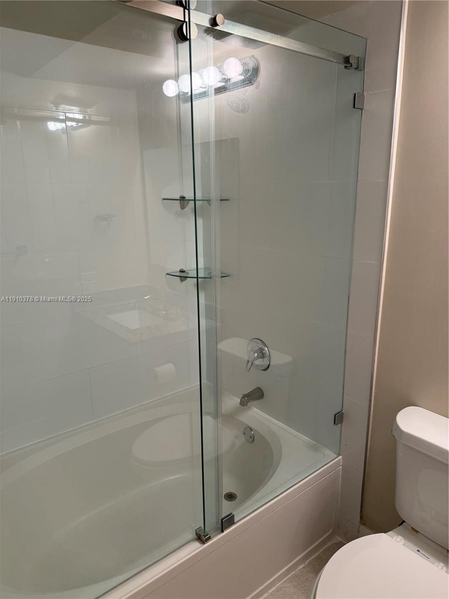 17150 North Bay Road, Unit 2102 Sunny Isles Beach, FL 33160 - Photo 16 of 29 a bathroom with a toilet and a shower