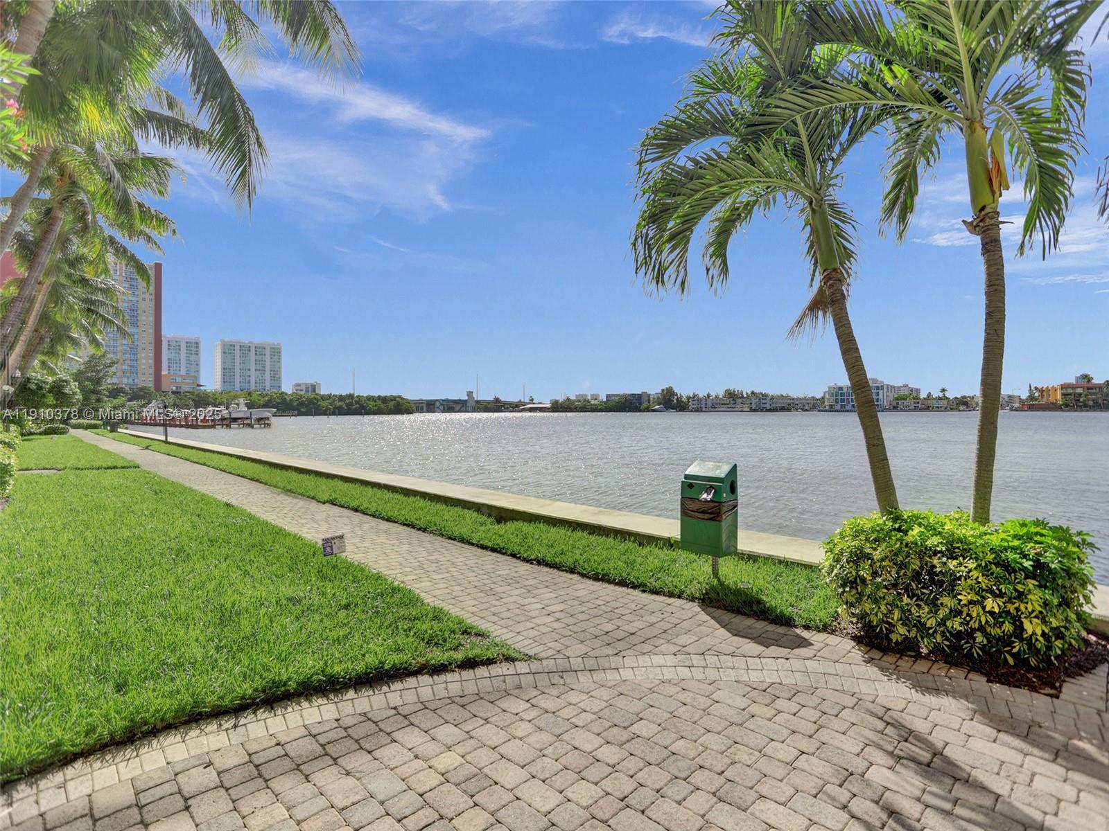 17150 North Bay Road, Unit 2102 Sunny Isles Beach, FL 33160 - Photo 21 of 29 a house with outdoor space and lake view