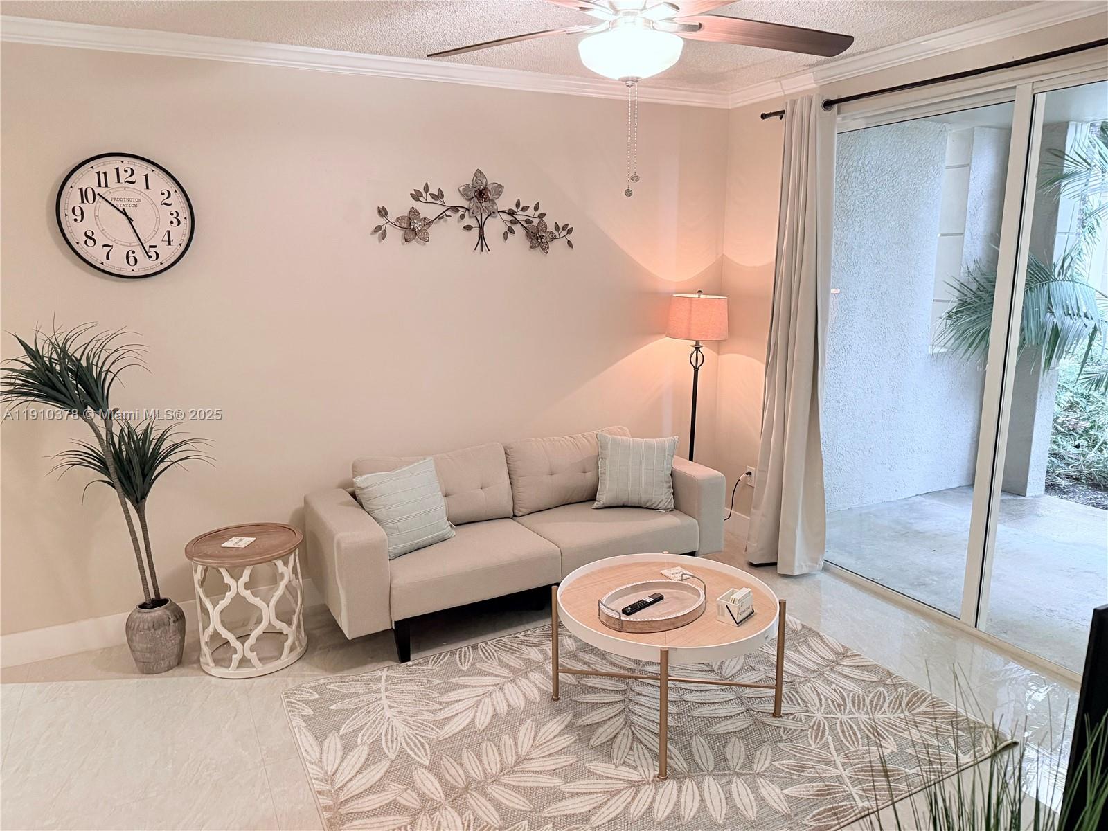 17150 North Bay Road, Unit 2102 Sunny Isles Beach, FL 33160 - Photo 7 of 29 a living room with furniture and a table