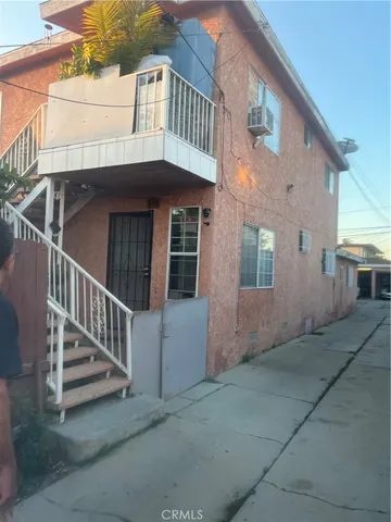 a view of a house with iron fence