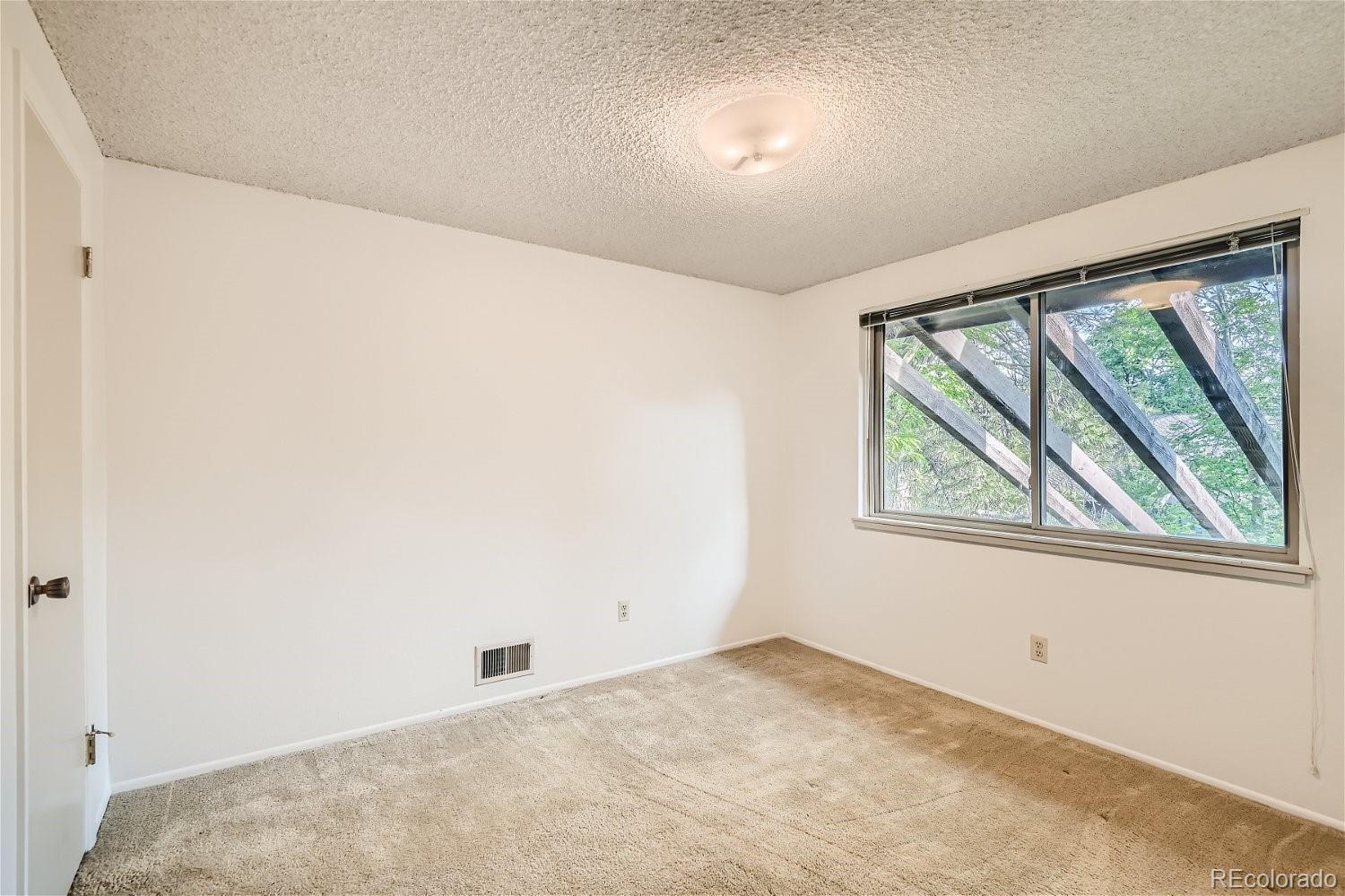 3398 East Easter Place Centennial, CO 80122 - Photo 19 of 28 an empty room with a window