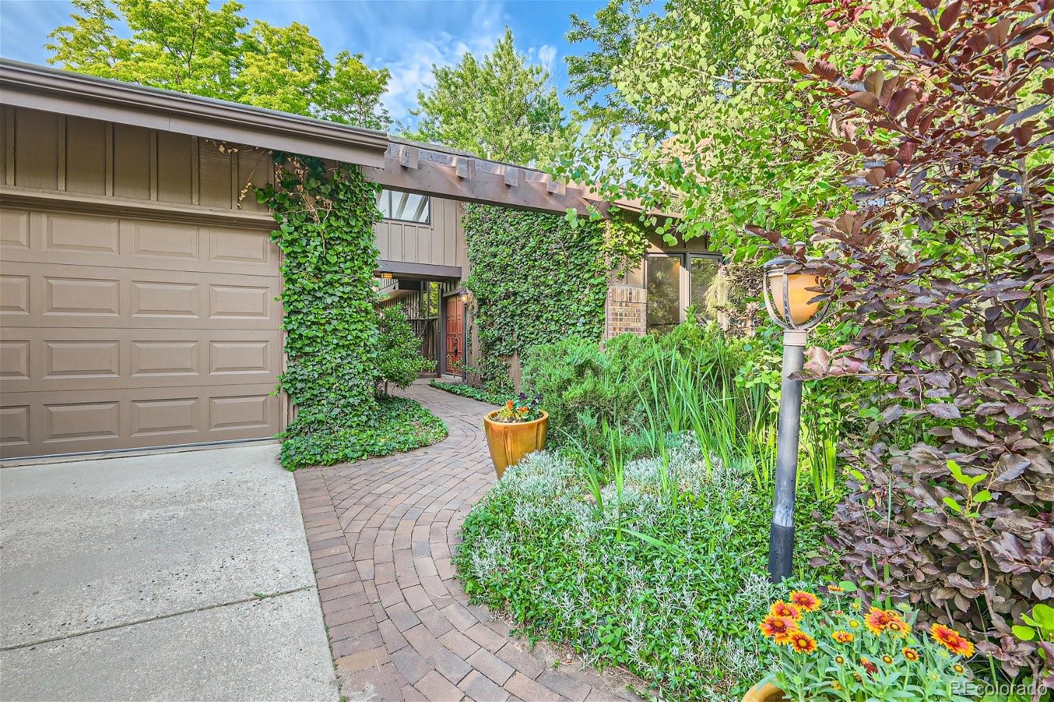 3398 East Easter Place Centennial, CO 80122 - Photo 2 of 28 a backyard of a house with lots of green space