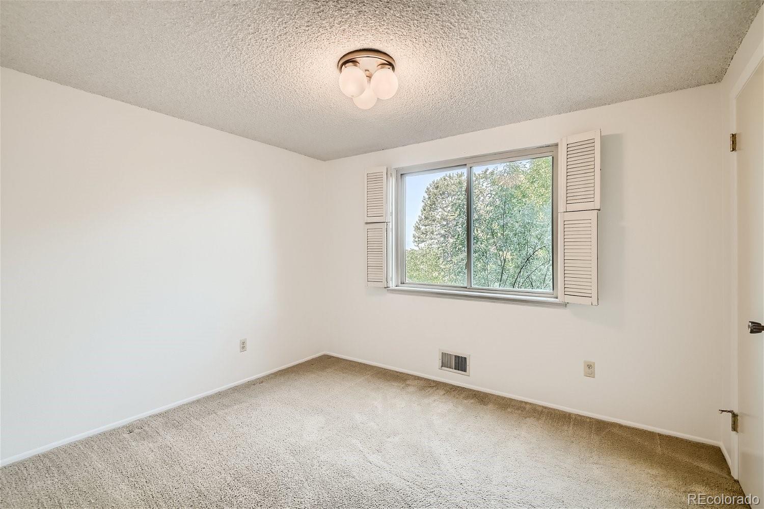 3398 East Easter Place Centennial, CO 80122 - Photo 21 of 28 an empty room with a window