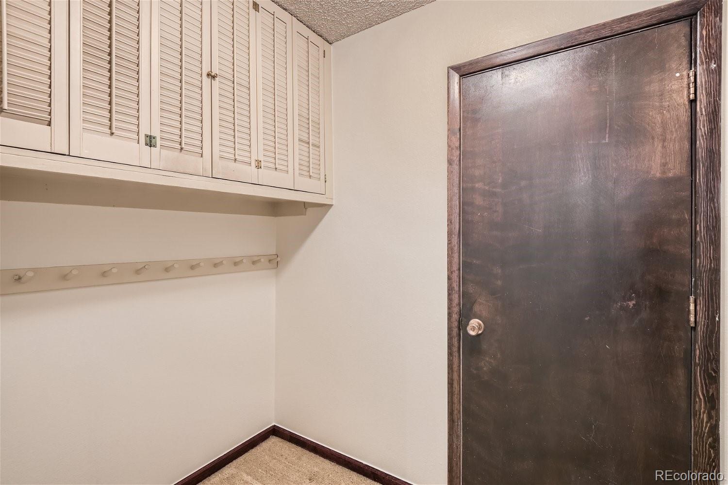3398 East Easter Place Centennial, CO 80122 - Photo 23 of 28 a view of a small space with wooden floor and a window