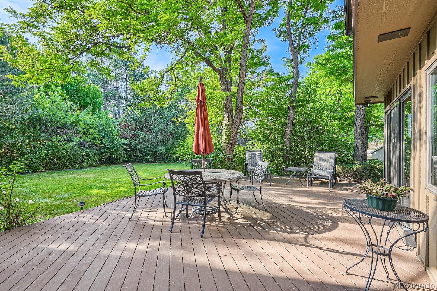 3398 East Easter Place Centennial, CO 80122 - Photo 24 of 28 a view of a chair and table on the wooden deck