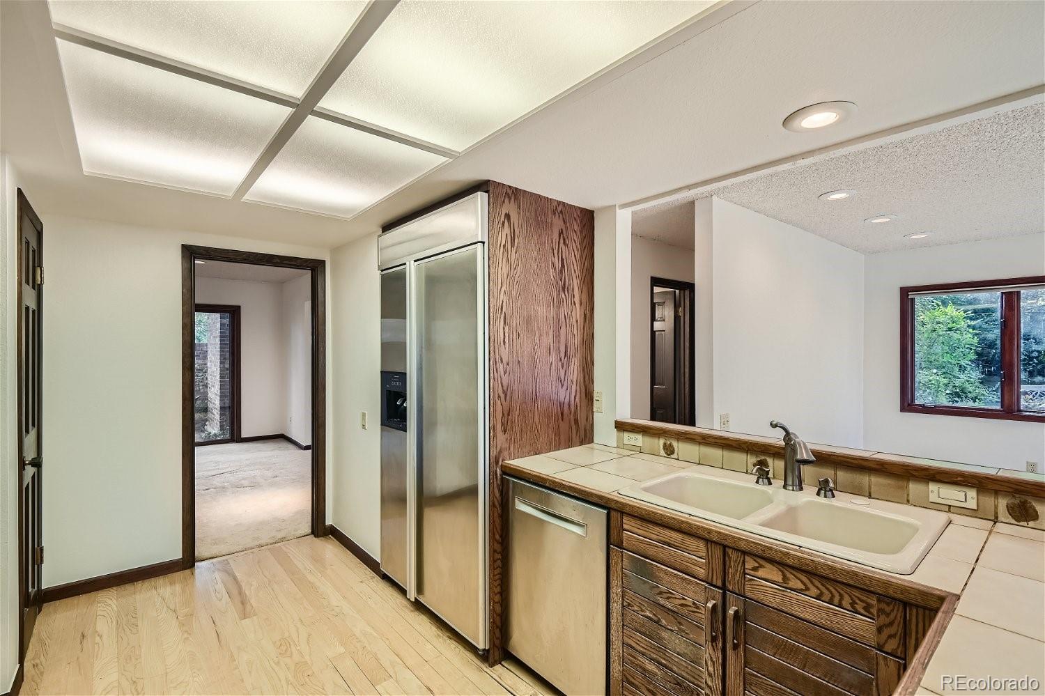 3398 East Easter Place Centennial, CO 80122 - Photo 6 of 28 a en suite bathroom with a sink mirror and shower