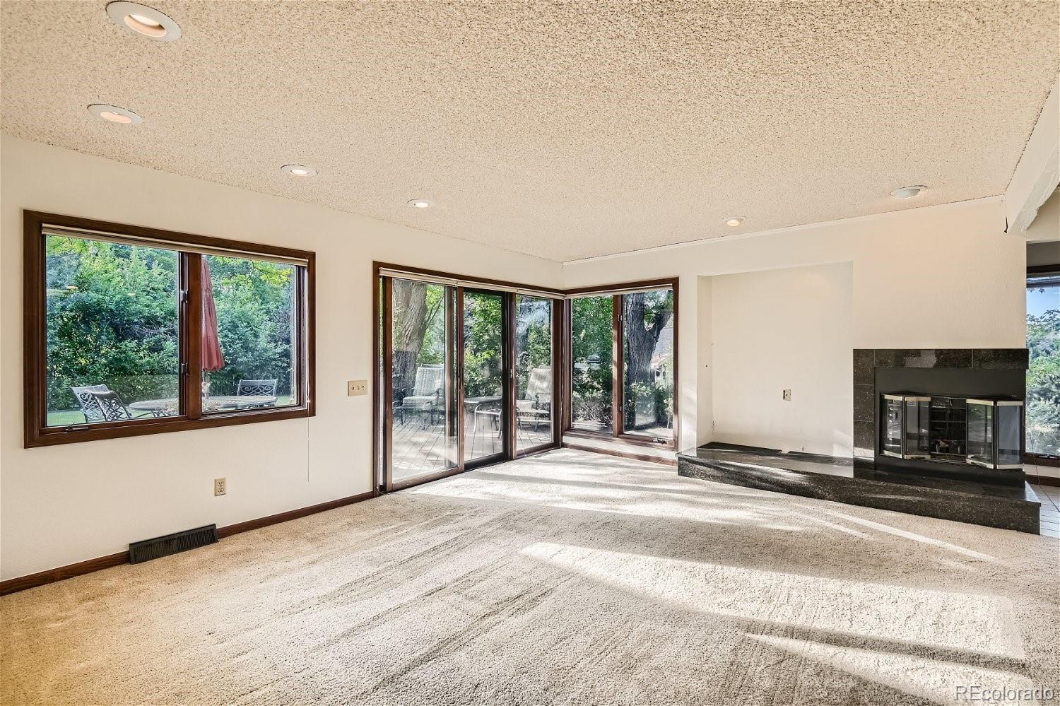 3398 East Easter Place Centennial, CO 80122 - Photo 9 of 28 a spacious bedroom with a large bed and a large window