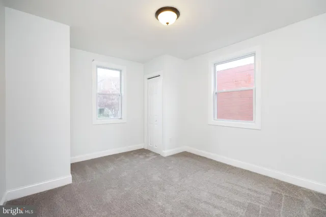 an empty room with windows