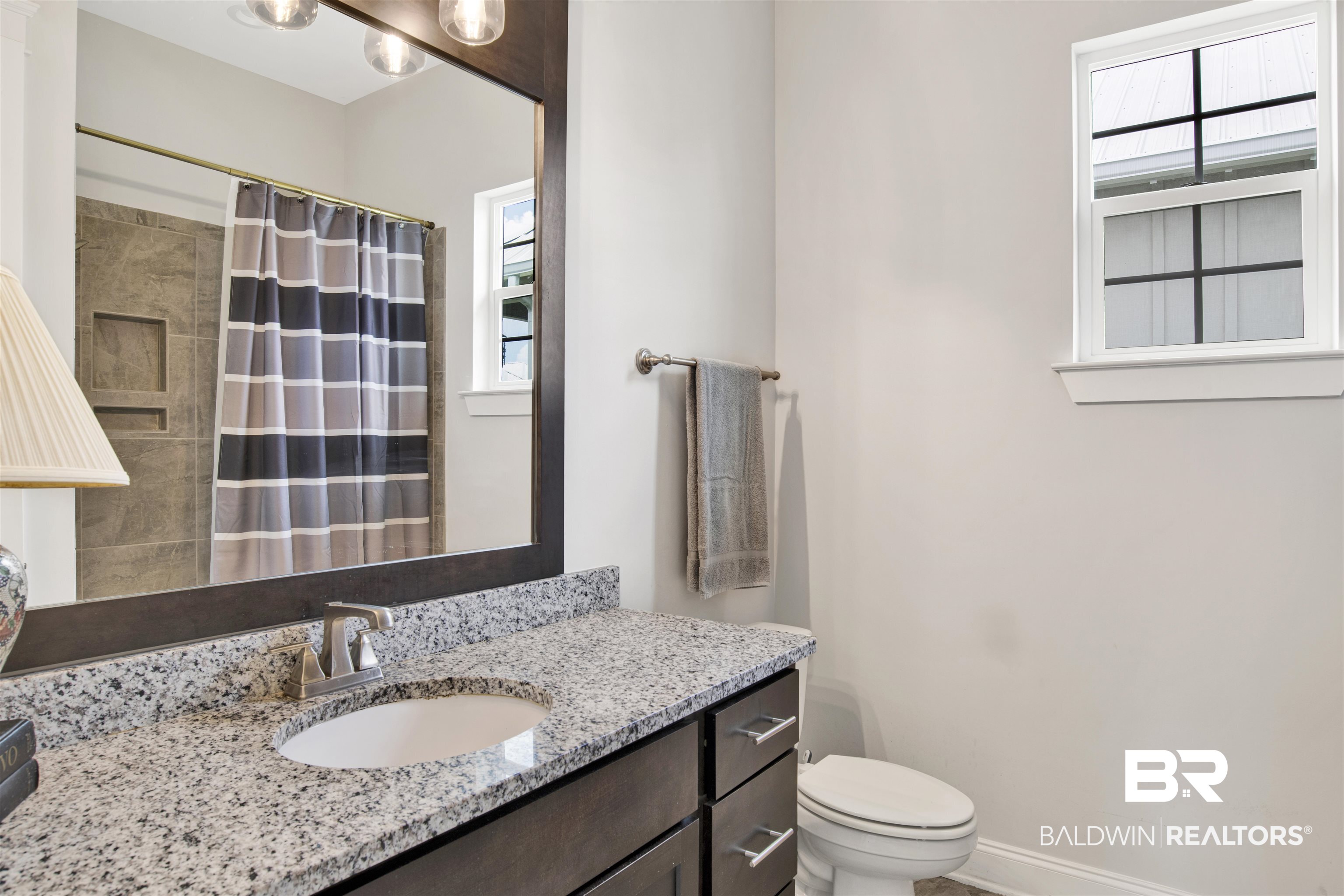 23893 Cypress Crossing Orange Beach, AL 36561 - Photo 7 of 22 Bathroom with vanity and a shower with curtain