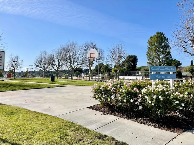 a view of a swimming pool with an outdoor seating and a garden