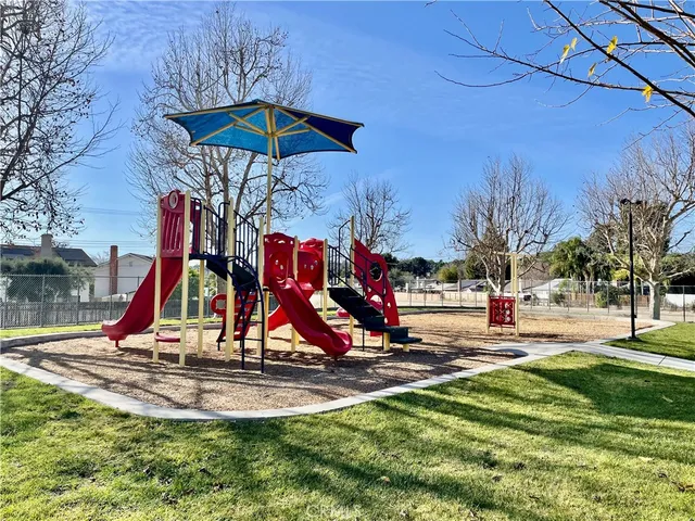 a view of a swimming pool with an outdoor seating and a garden
