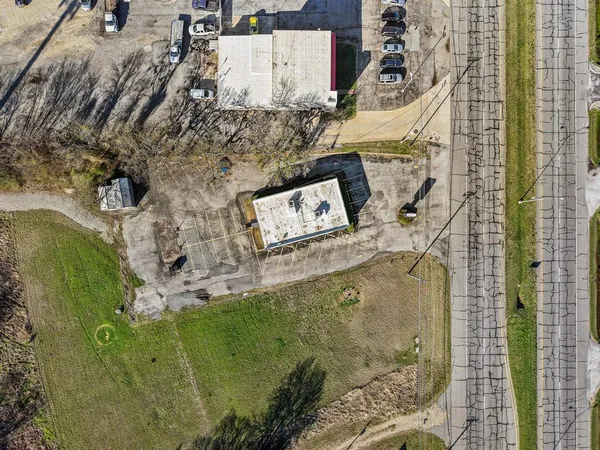 with aerial view of a house with a yard