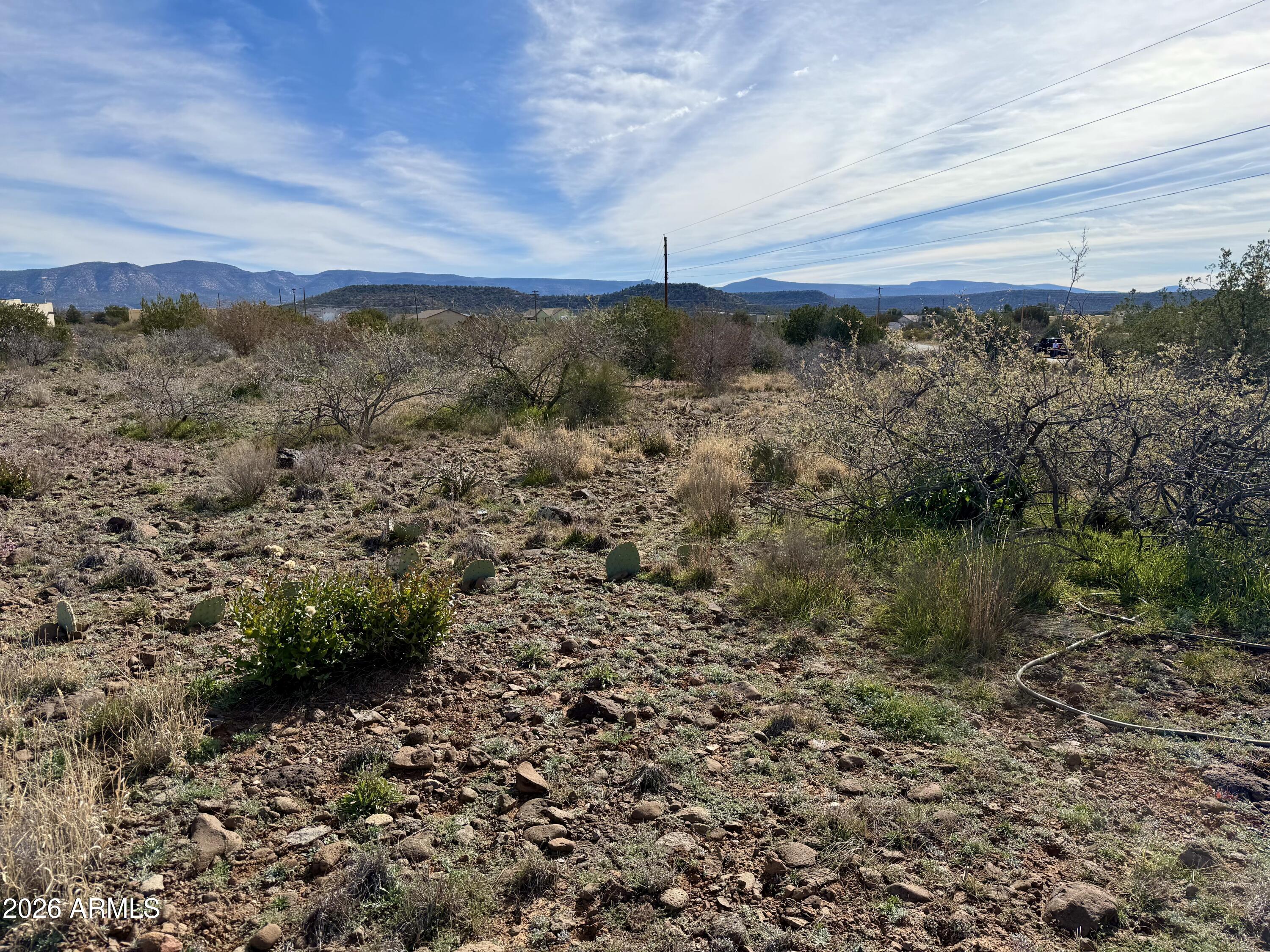 4790-4780 Smoke Signal Way, Unit 132 Rimrock, AZ 86335 - Photo 16 of 26 a view of a yard with wooden fence