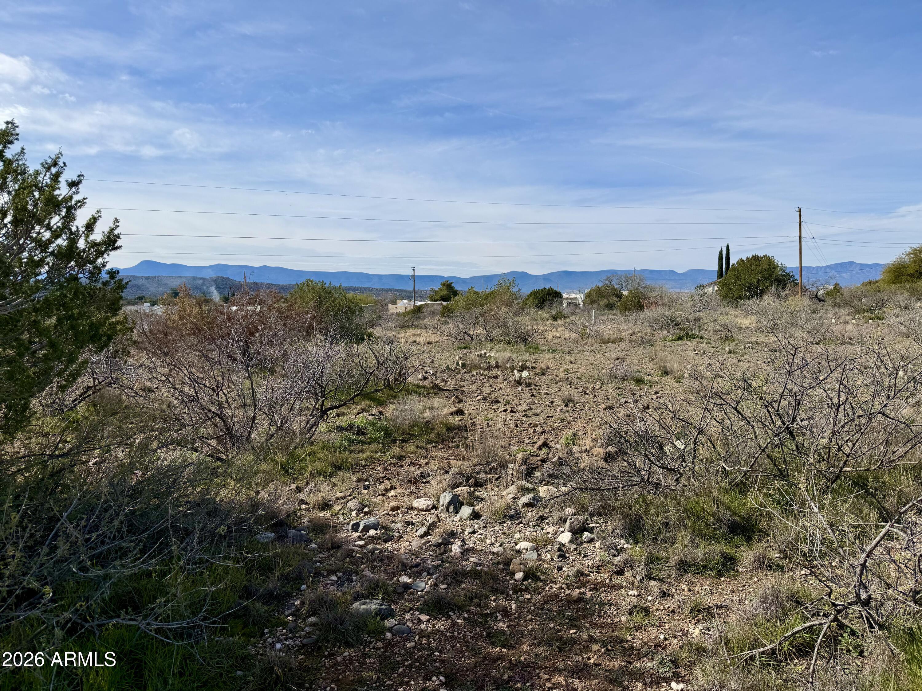 4790-4780 Smoke Signal Way, Unit 132 Rimrock, AZ 86335 - Photo 18 of 26 a view of a field with a tree in it