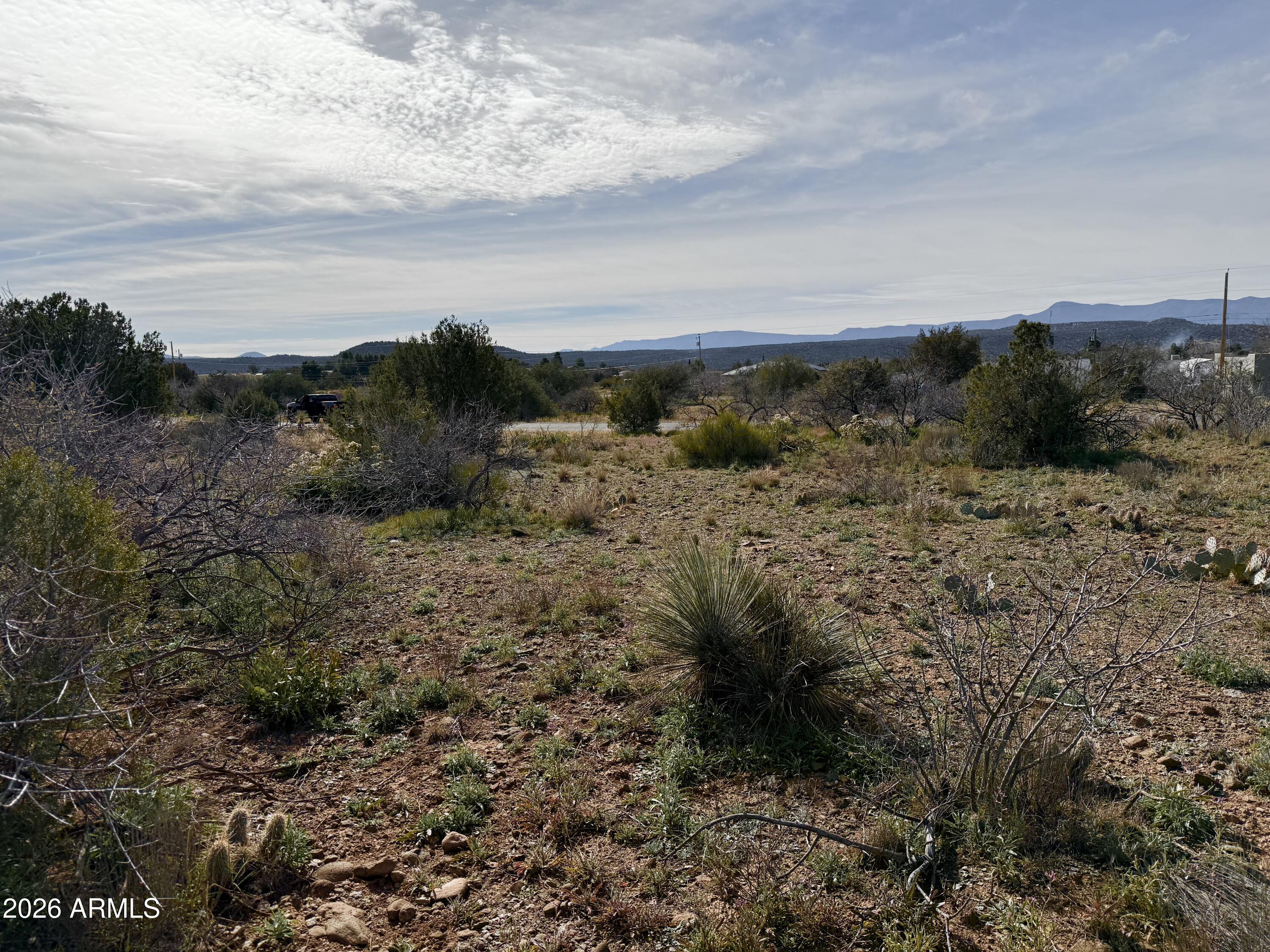 4790-4780 Smoke Signal Way, Unit 132 Rimrock, AZ 86335 - Photo 23 of 26 a view of a dry yard with lots of bushes