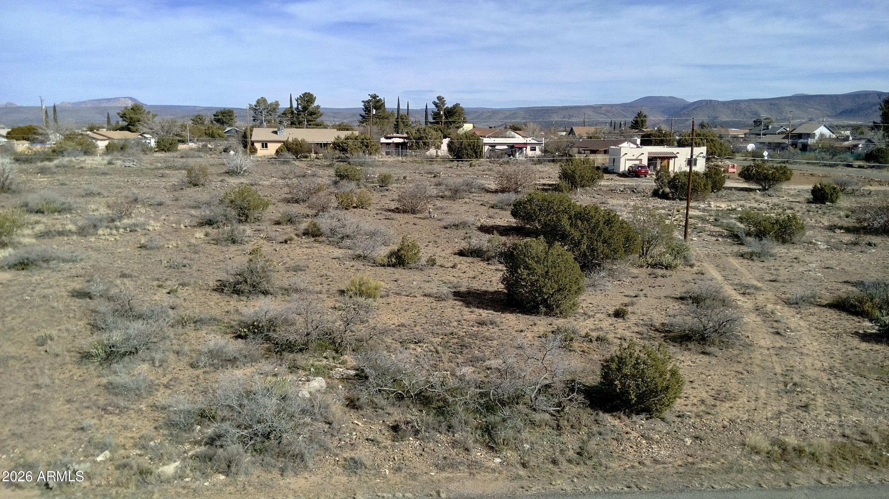 4790-4780 Smoke Signal Way, Unit 132 Rimrock, AZ 86335 - Photo 24 of 26 a view of a dry yard with lots of trees
