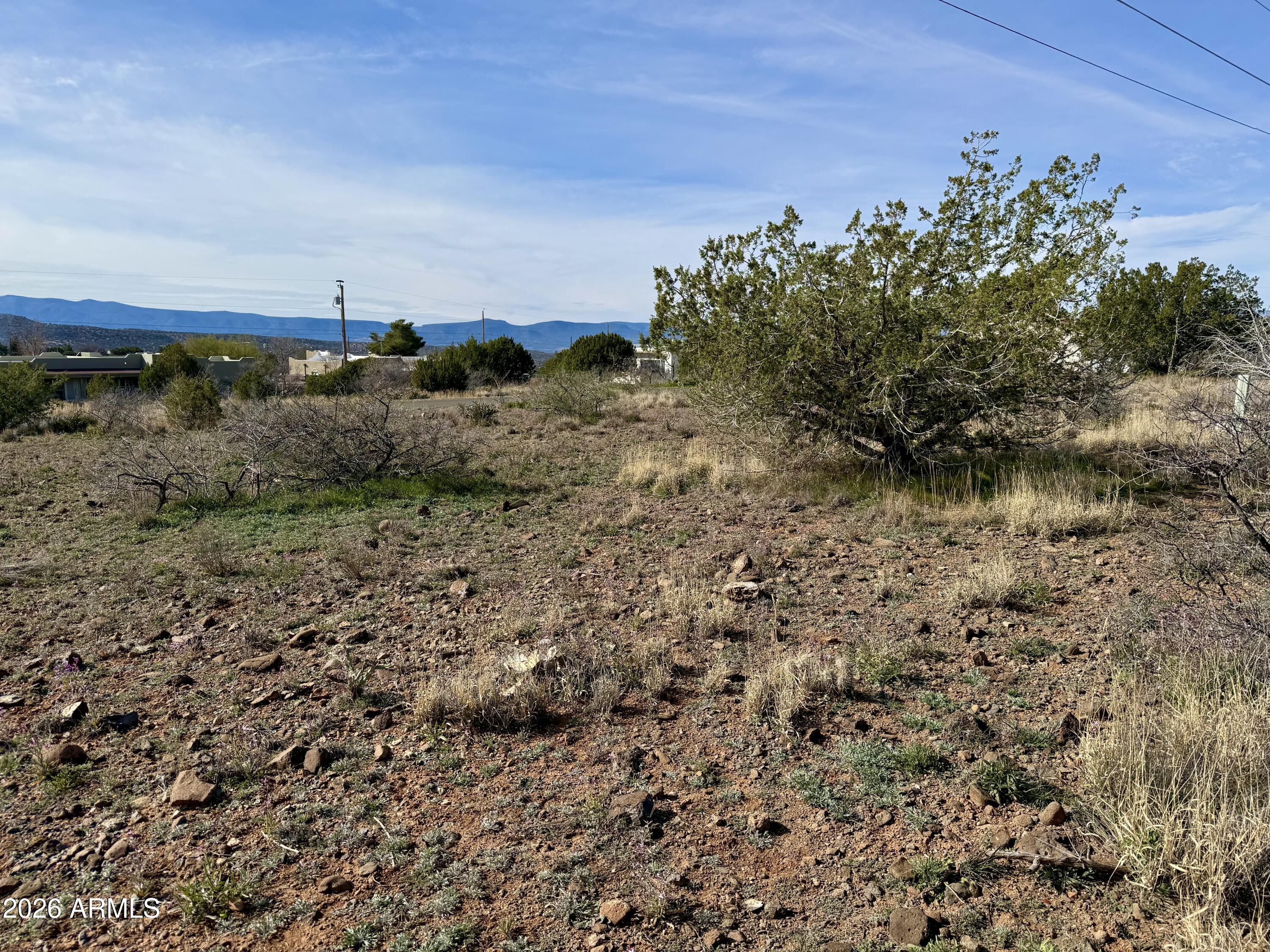 4790-4780 Smoke Signal Way, Unit 132 Rimrock, AZ 86335 - Photo 25 of 26 a view of a yard with wooden fence
