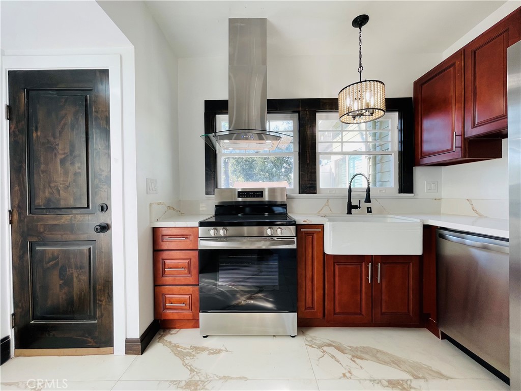 3225 Locust Street Riverside, CA 92501 - Photo 19 of 63 a kitchen with stainless steel appliances granite countertop a sink stove and refrigerator