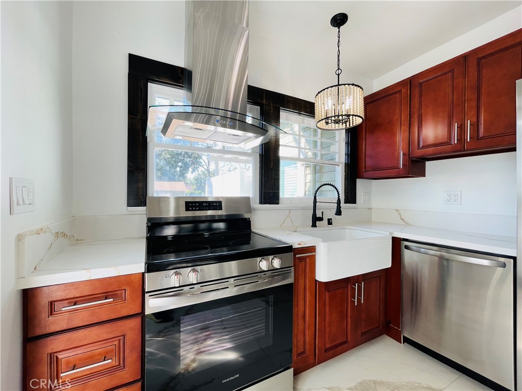 3225 Locust Street Riverside, CA 92501 - Photo 20 of 63 a kitchen with stainless steel appliances granite countertop a sink a stove and a wooden floors