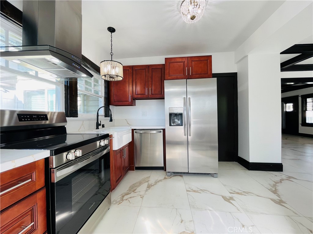 3225 Locust Street Riverside, CA 92501 - Photo 21 of 63 a kitchen with stainless steel appliances granite countertop a stove a refrigerator and a sink