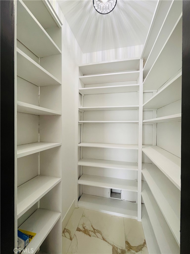 3225 Locust Street Riverside, CA 92501 - Photo 23 of 63 a view of walk in closet with empty racks