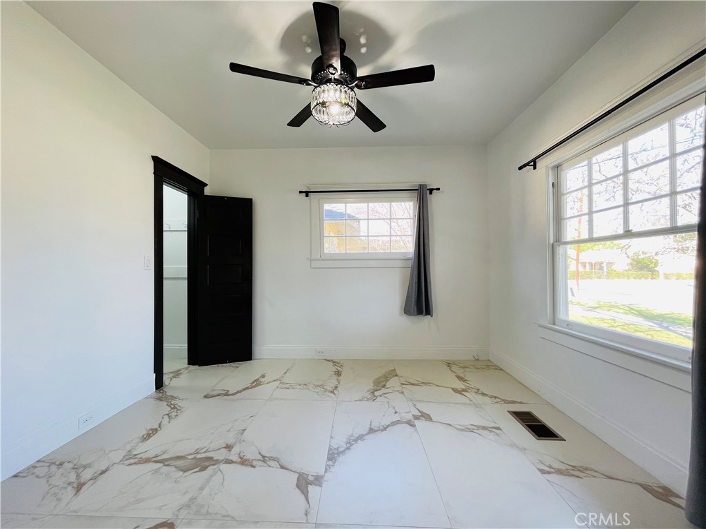 3225 Locust Street Riverside, CA 92501 - Photo 27 of 63 a bedroom with a bed and a window