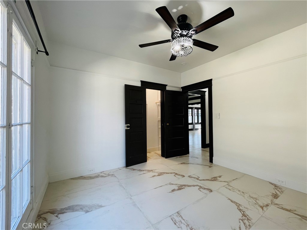 3225 Locust Street Riverside, CA 92501 - Photo 30 of 63 a view of a livingroom with a ceiling fan and window