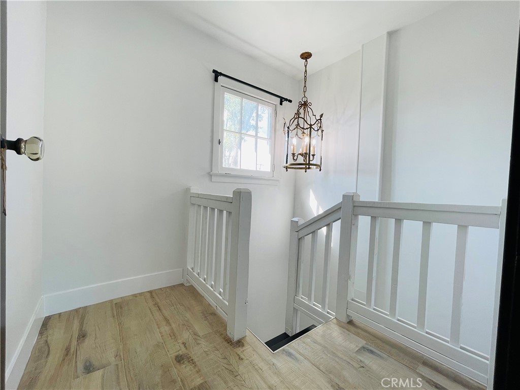 3225 Locust Street Riverside, CA 92501 - Photo 36 of 63 a view of empty room with wooden floor and fan