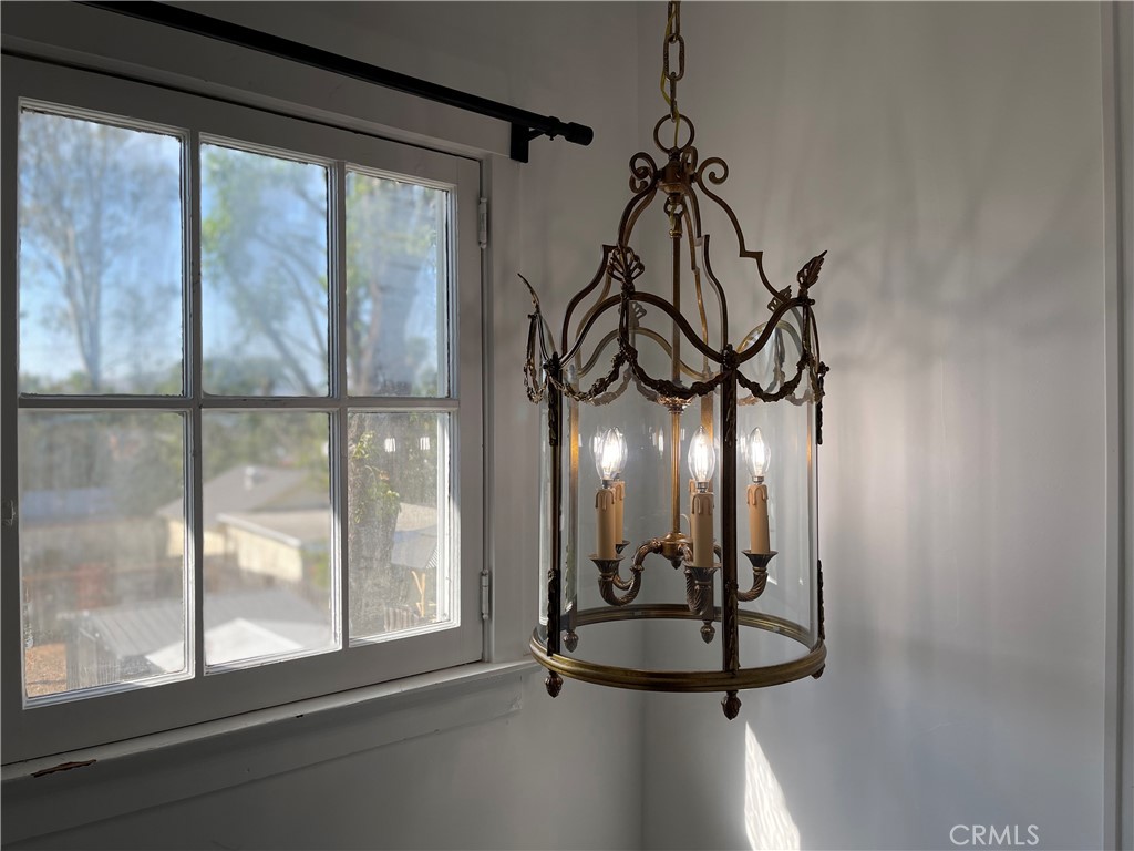 3225 Locust Street Riverside, CA 92501 - Photo 37 of 63 a glass door with a glass top table and chairs