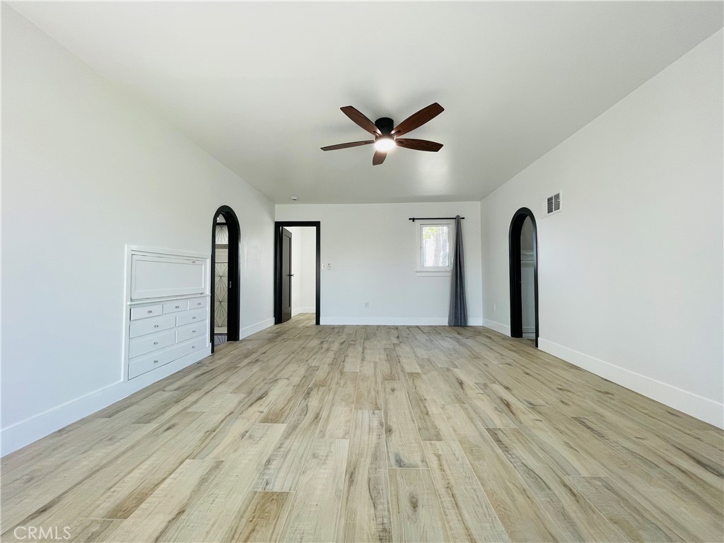 3225 Locust Street Riverside, CA 92501 - Photo 38 of 63 a view of empty room with wooden floor and fan
