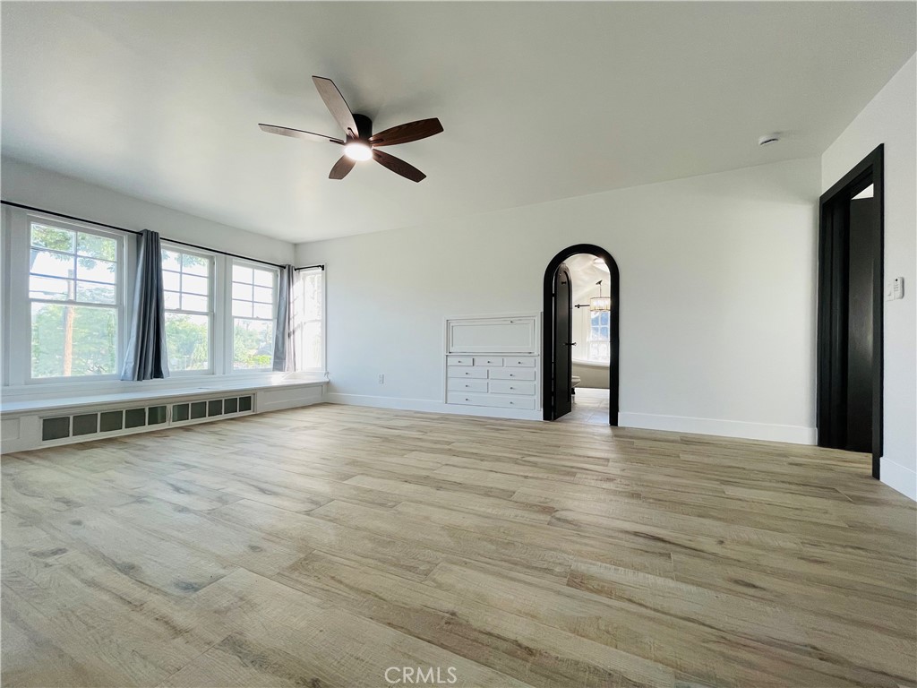 3225 Locust Street Riverside, CA 92501 - Photo 41 of 63 a view of an empty room with window and wooden floor