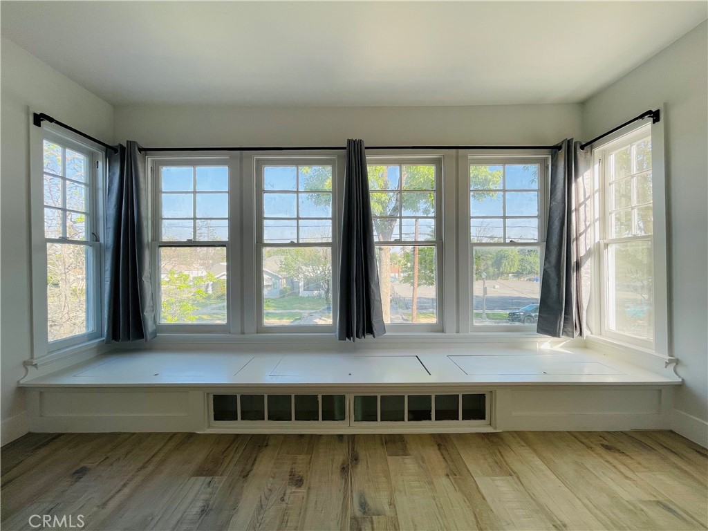 3225 Locust Street Riverside, CA 92501 - Photo 42 of 63 a large room with wooden floor and a window