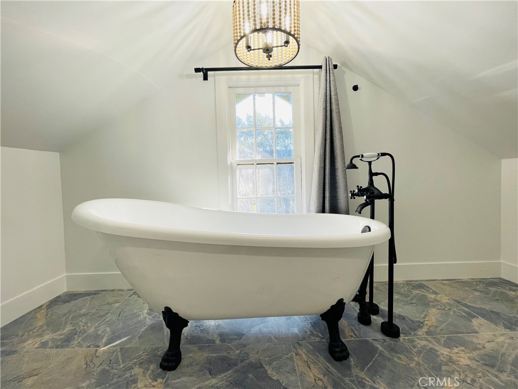3225 Locust Street Riverside, CA 92501 - Photo 46 of 63 a bathroom with a sink a toilet and a window