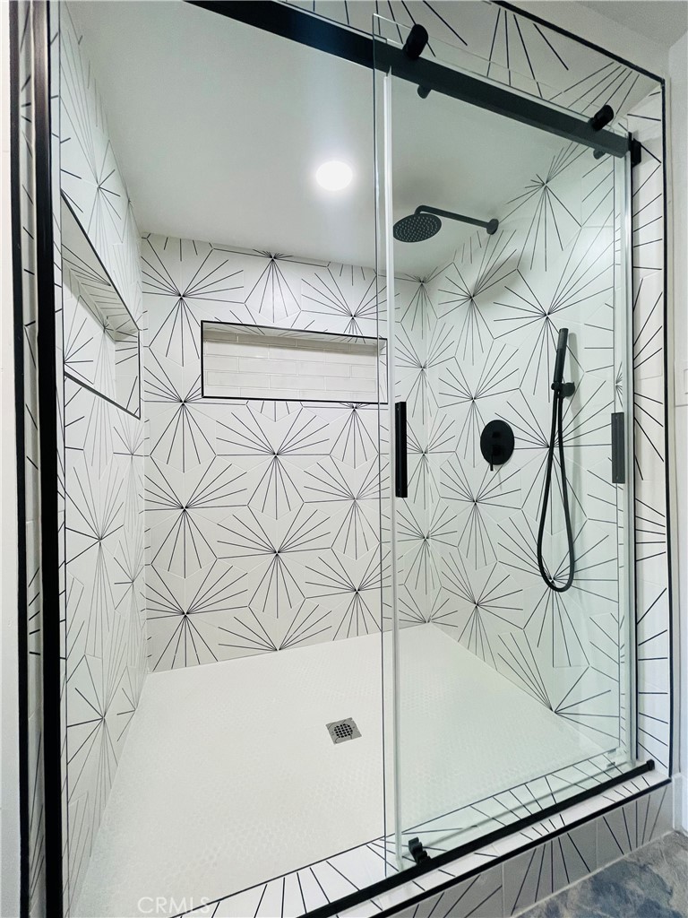 3225 Locust Street Riverside, CA 92501 - Photo 49 of 63 a bathroom with a bathtub and shower