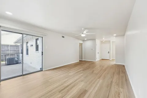 a bathroom with a sink a toilet a mirror and shower
