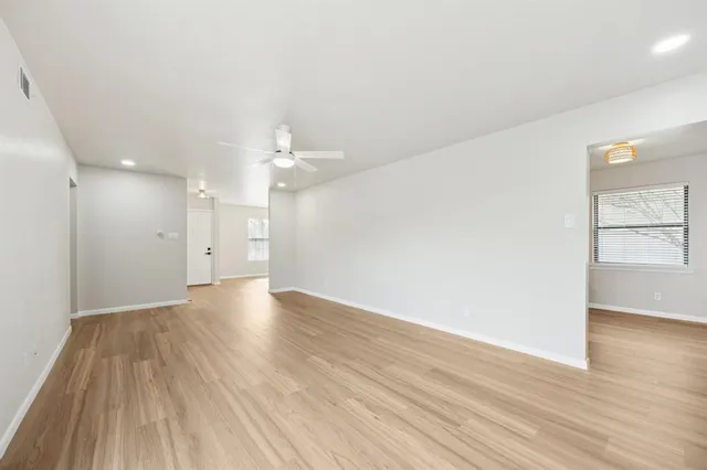 a spacious bathroom with a double vanity sink toilet and shower