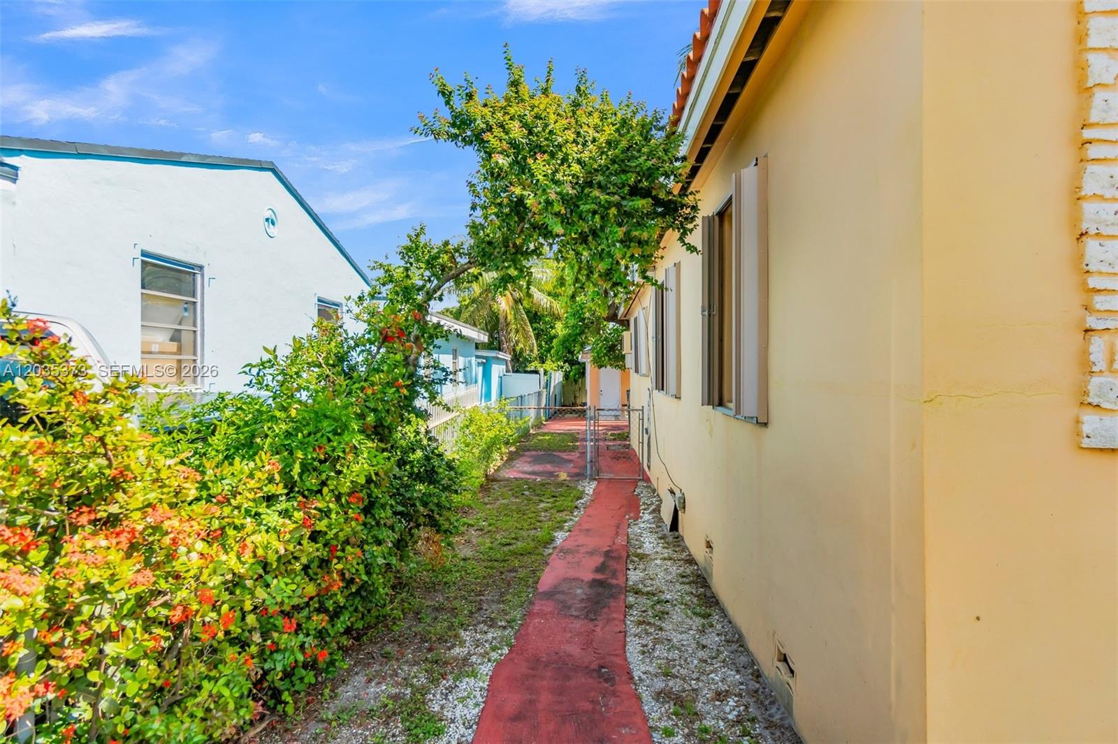 151 East 16th Street Hialeah, FL 33010 - Photo 23 of 37 Walk way to the back yard and structure at the back of the property