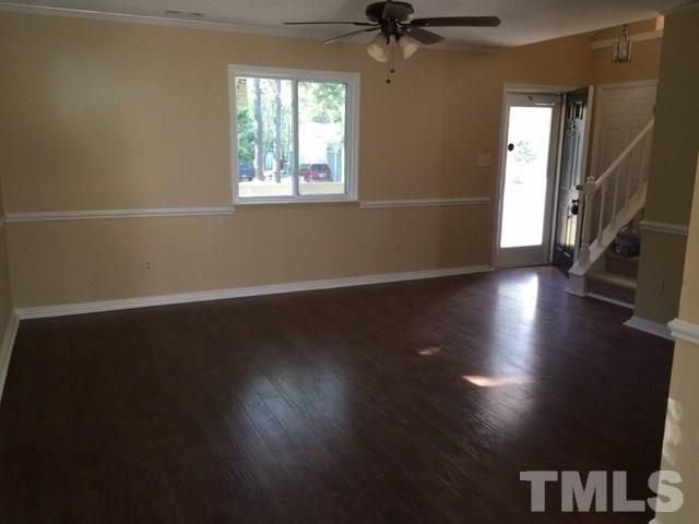 5109 Dice Drive Raleigh, NC 27616 - Photo 12 of 22 a view of an empty room with wooden floor and a window