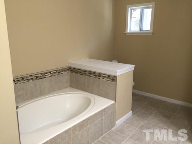 5109 Dice Drive Raleigh, NC 27616 - Photo 17 of 22 a bathroom with a bathtub
