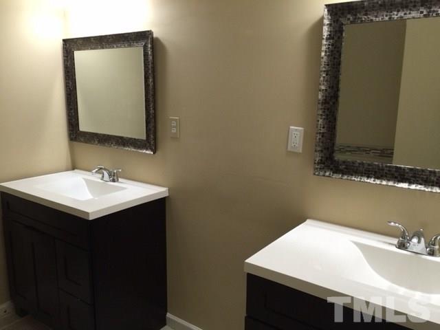 5109 Dice Drive Raleigh, NC 27616 - Photo 19 of 22 a bathroom with a sink vanity and a mirror