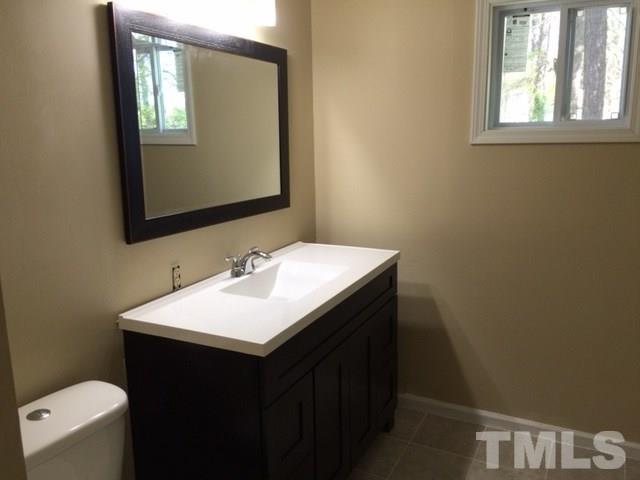 5109 Dice Drive Raleigh, NC 27616 - Photo 20 of 22 a bathroom with a sink and a mirror