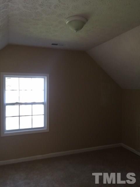 5109 Dice Drive Raleigh, NC 27616 - Photo 21 of 22 a view of an empty room with a window