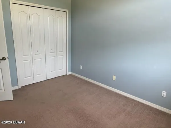 a bathroom with a toilet and a bathtub