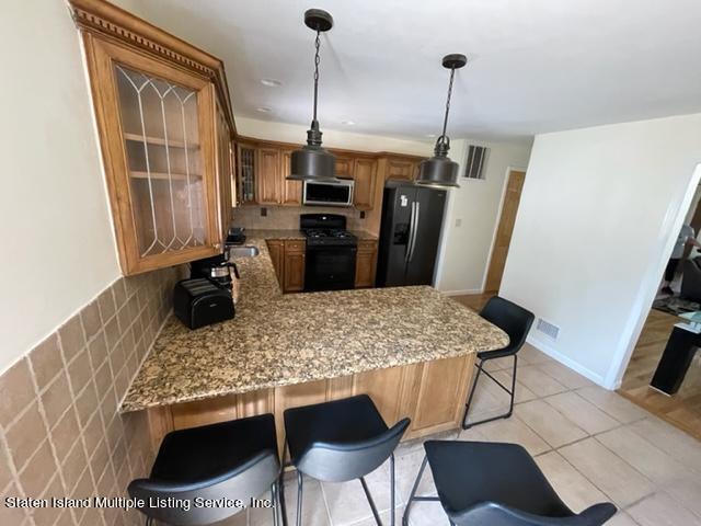 1004 Arthur Kill Road Staten Island, NY 10312 - Photo 3 of 13 thumbnail