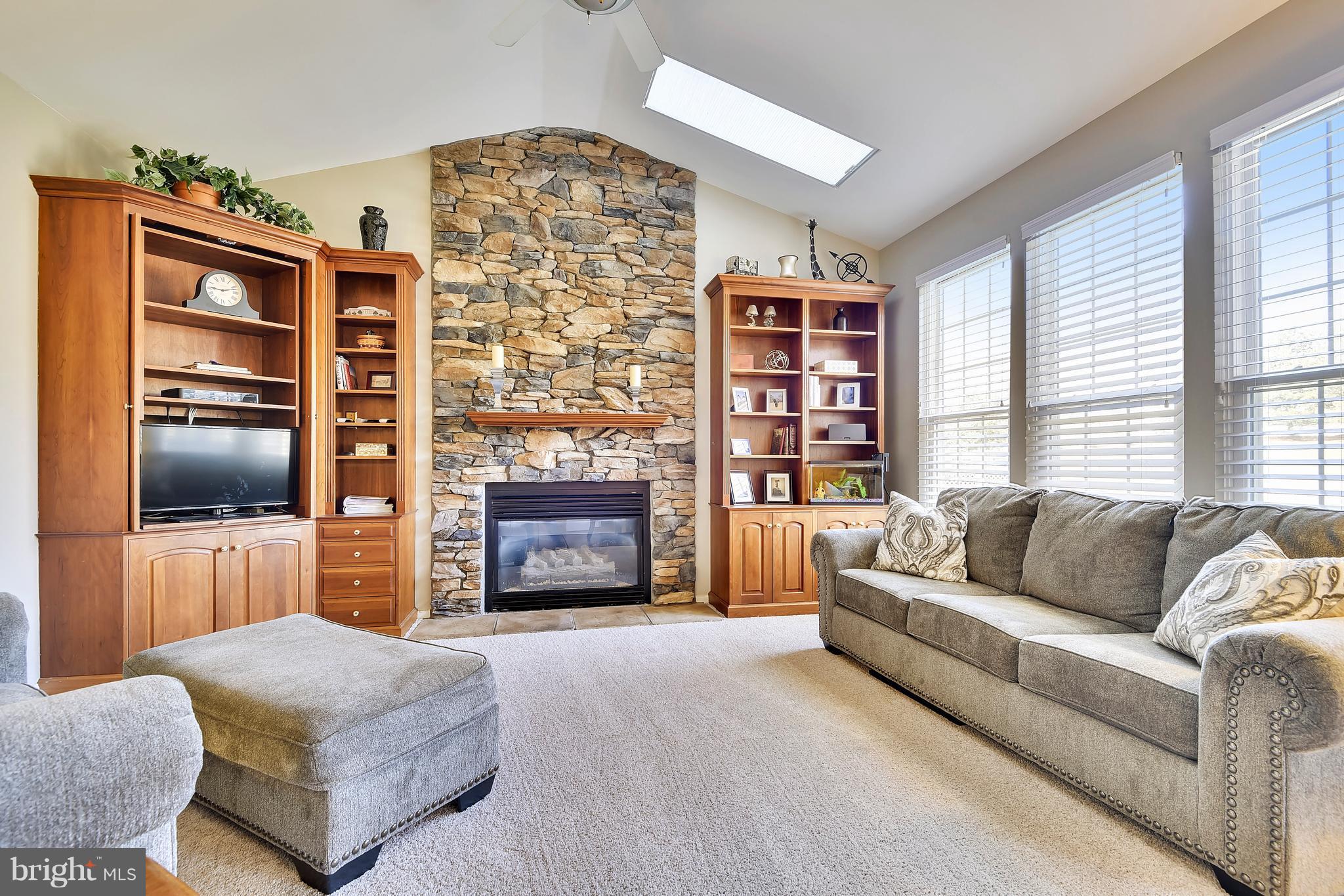 6 Ruffed Grouse Court Towson, MD 21286 - Photo 11 of 30 Gas Fireplace with stacked stone chimney