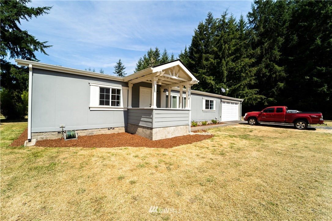 289 Antrim Road Winlock, WA 98596 - Photo 2 of 30 a front view of a house with a yard