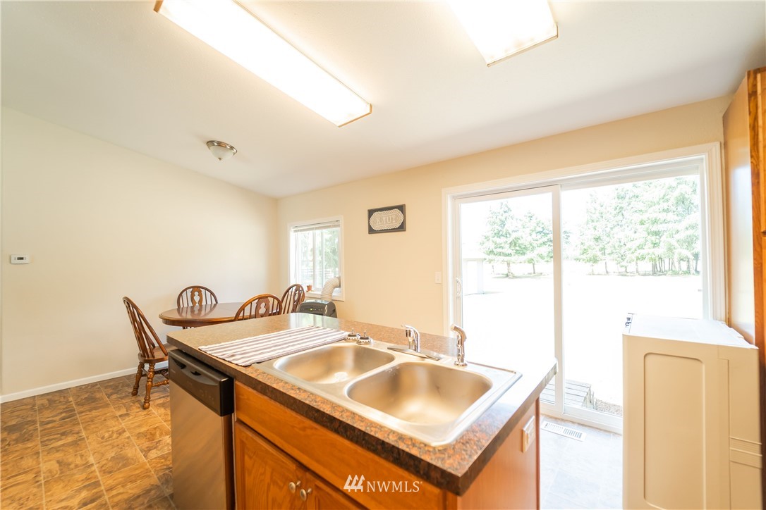 289 Antrim Road Winlock, WA 98596 - Photo 11 of 30 a dining room with a sink and a window