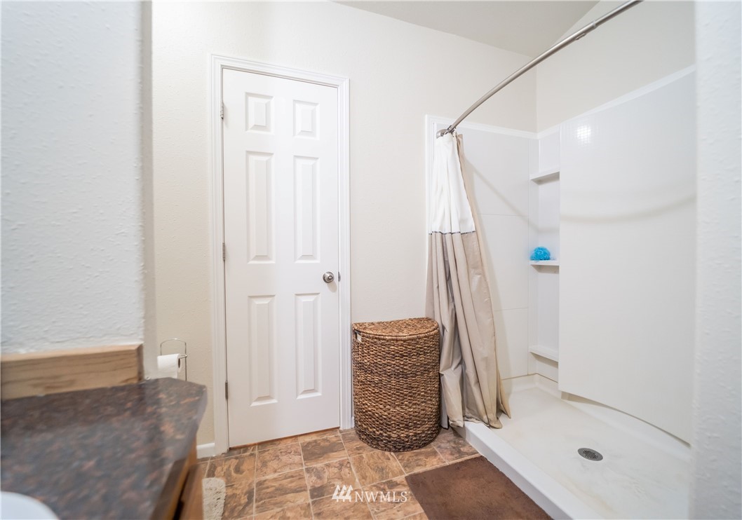 289 Antrim Road Winlock, WA 98596 - Photo 14 of 30 a view of walk in closet with clothes and shoes